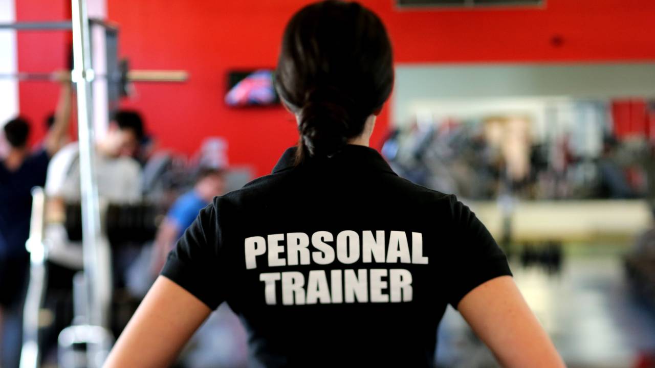 Personal trainer, woman in a gym